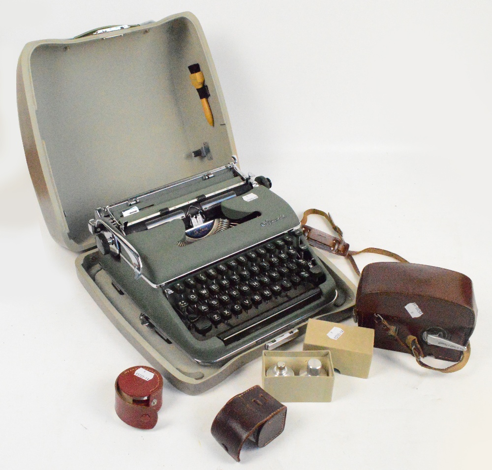 A cased Olympia typewriter, cameras etc.