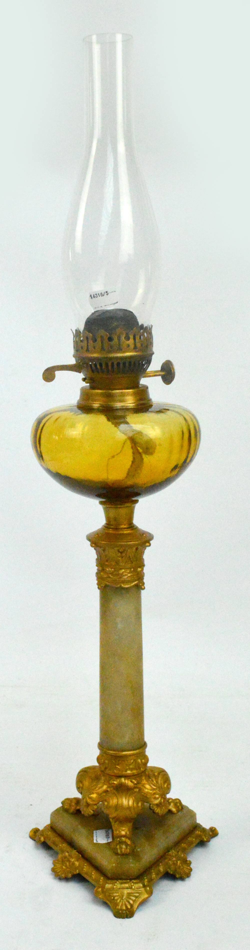 An onyx and spelter gilt lamp with glass fittings, height 75cm.
