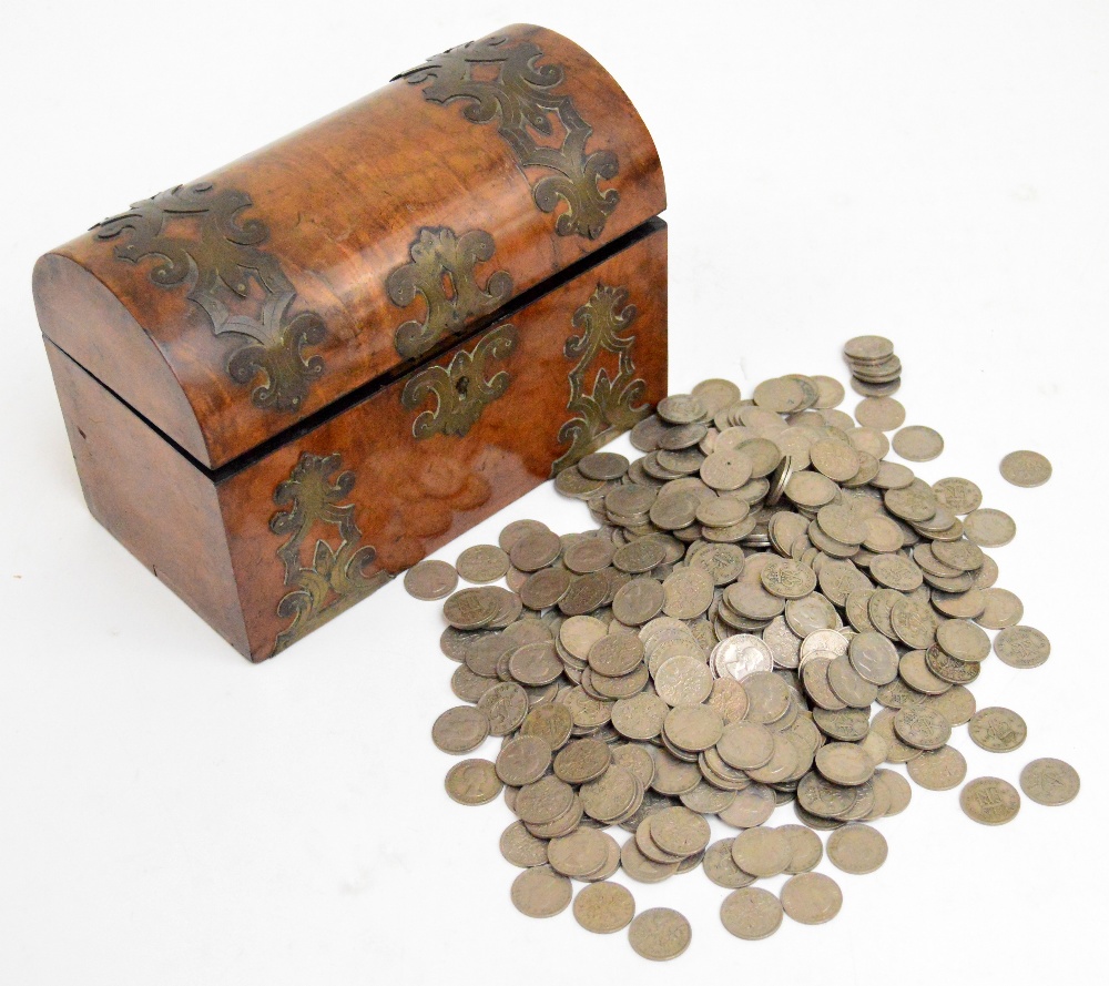 A Victorian walnut and brass strap bound dome topped trinket box, and a quantity of sixpences.