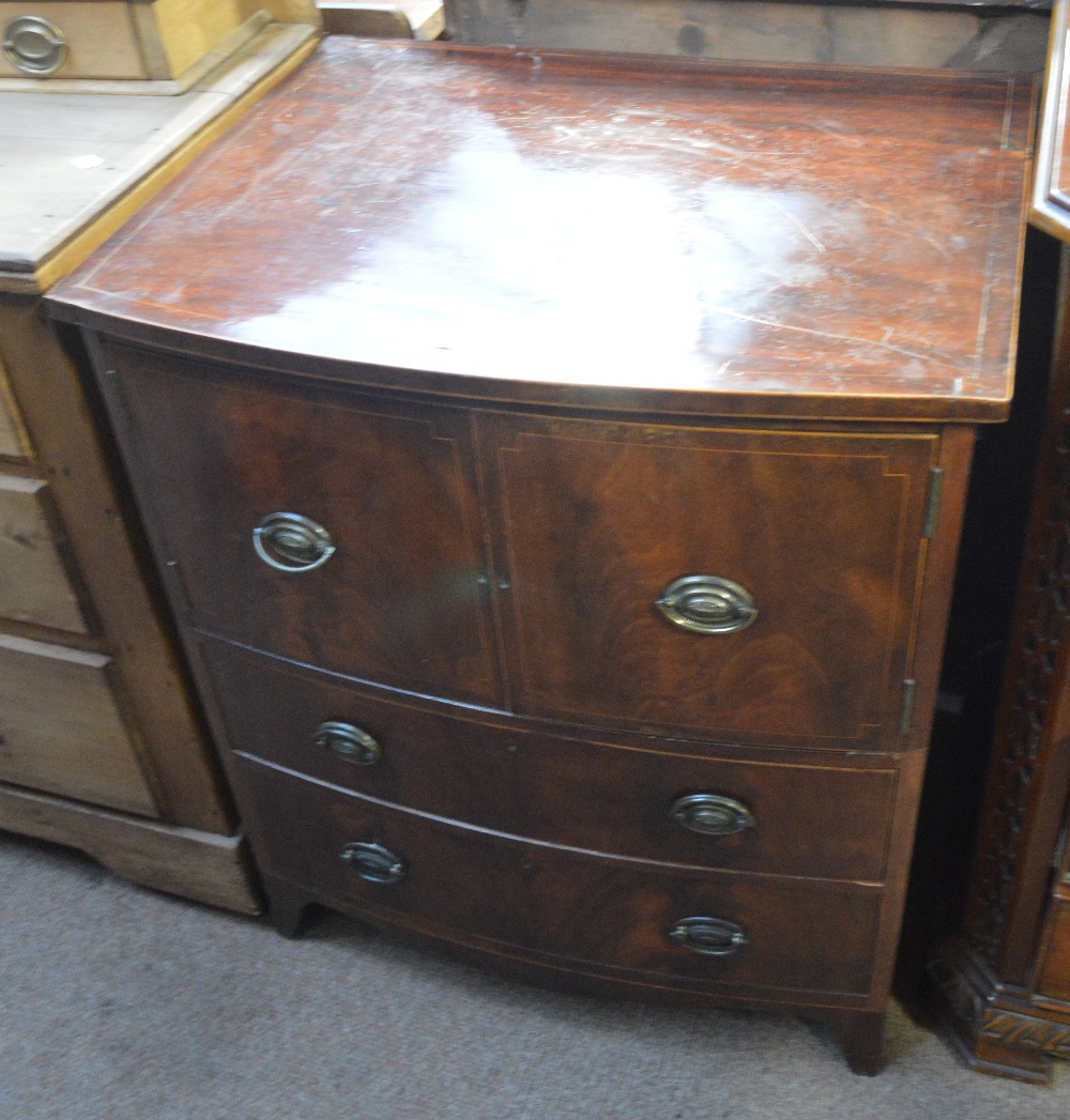 A 19th century boxwood strung bowfronted night table with twin cupboard doors above two drawers on