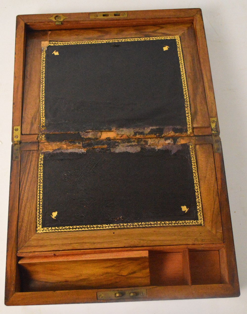 A late Victorian walnut and brass mounted writing slope with engraved initials to the shield