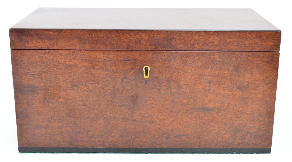 A 19th century mahogany rectangular tea caddy, the hinged lid enclosing two lidded lead lined