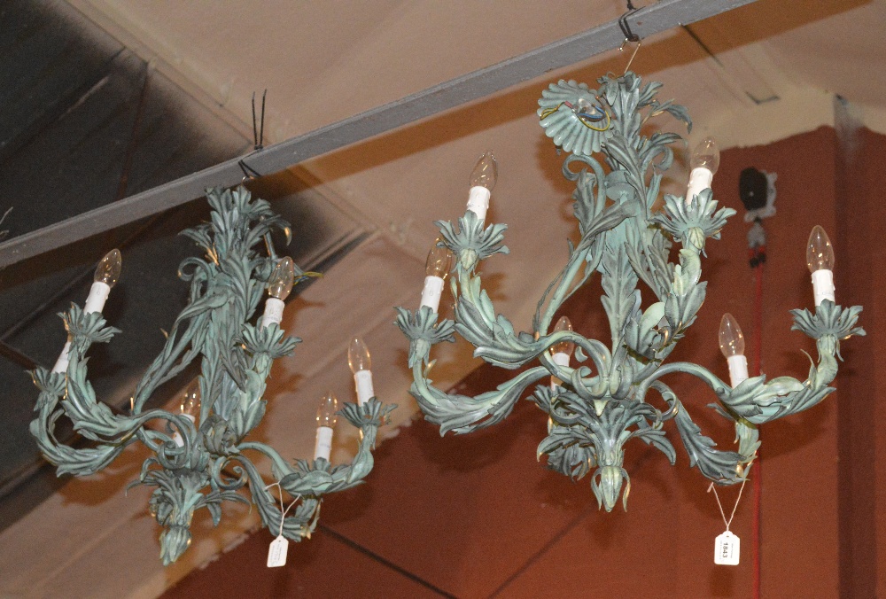 A pair of contemporary six branch leaf moulded verdigris electroliers.