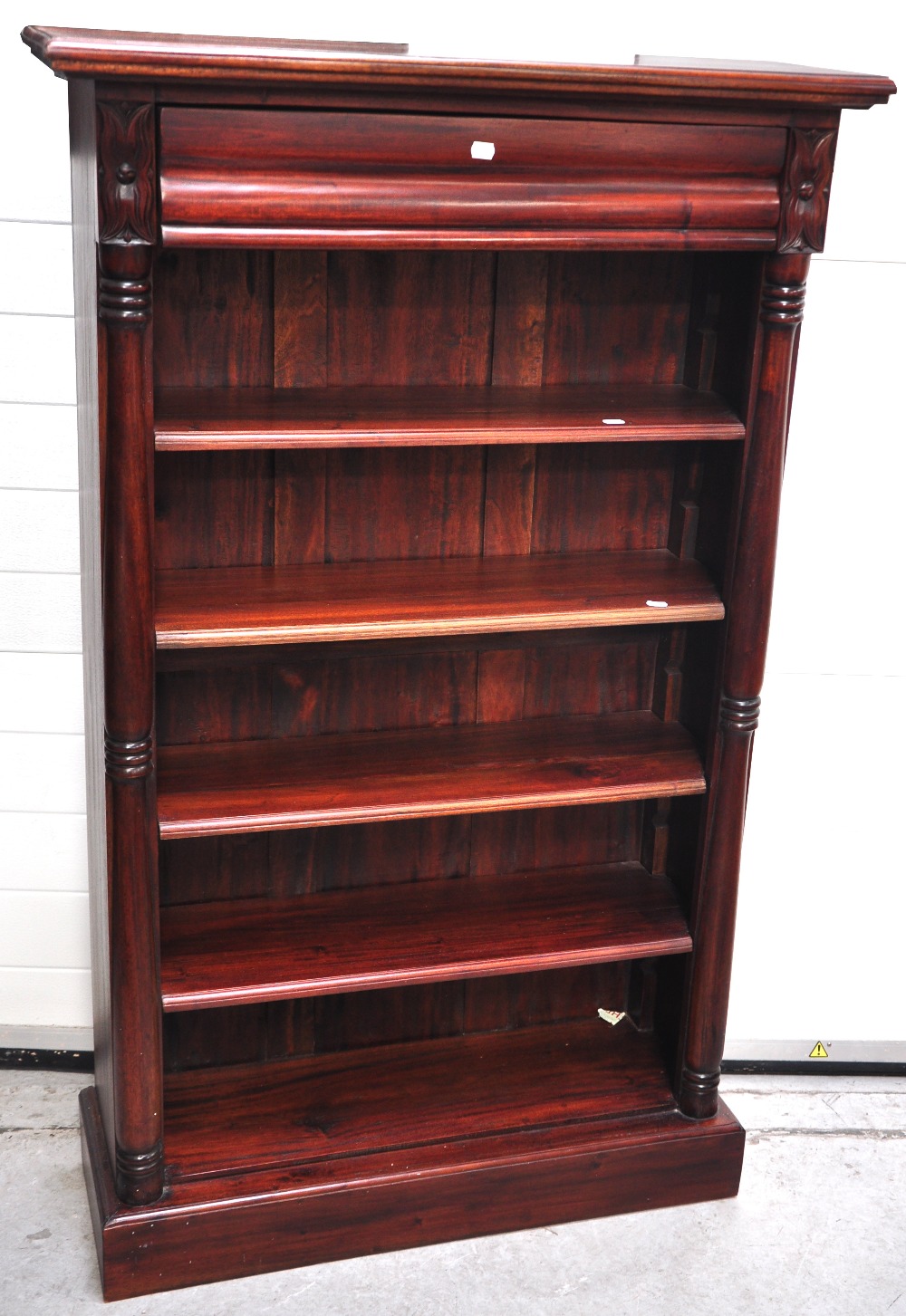 A reproduction mahogany bookshelf with drawer to the top, height 150cm.