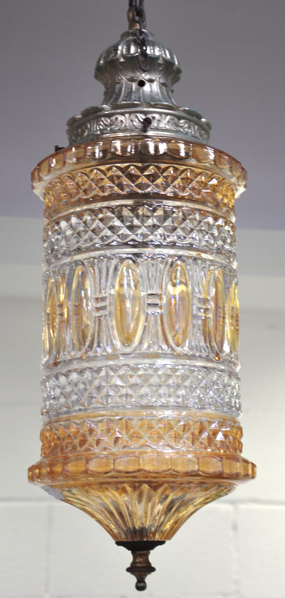 A 20th century hanging lantern with amber tinted shade.