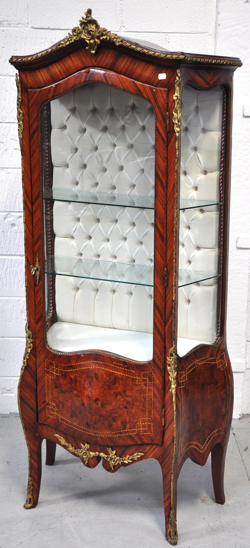 A French walnut and kingwood veneered gilt metal mounted vitrine, the glazed door with panelled