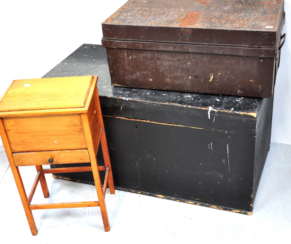 A black painted pine chest, length 102cm, a metal travelling chest, length 69cm and a sewing box