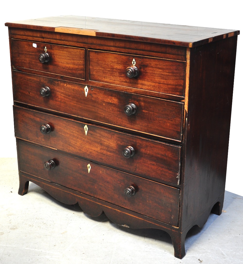 A Victorian mahogany chest of two short and three long drawers on splayed bracket feet (for