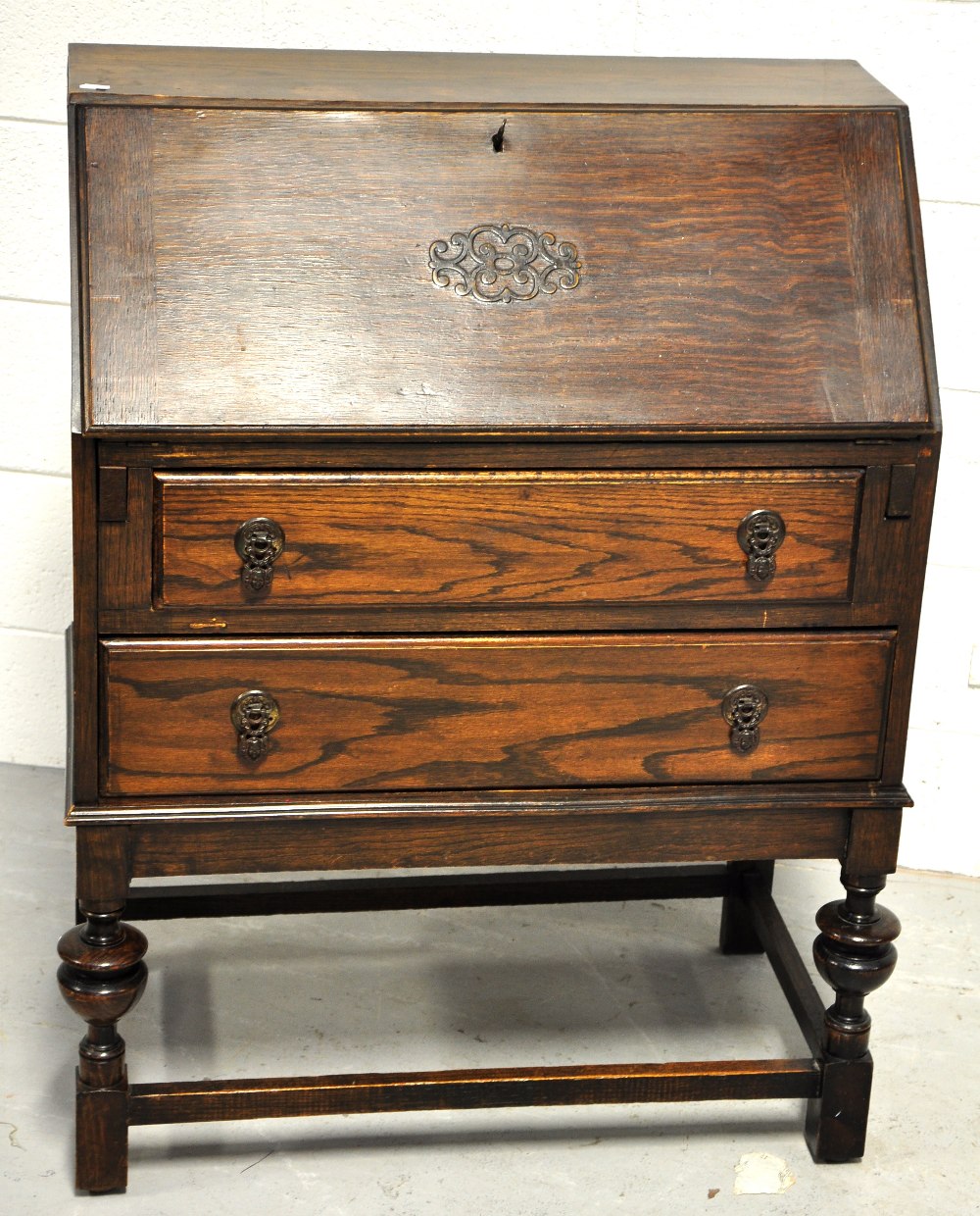 An early 20th century oak bureau of small proportion, height 97cm.