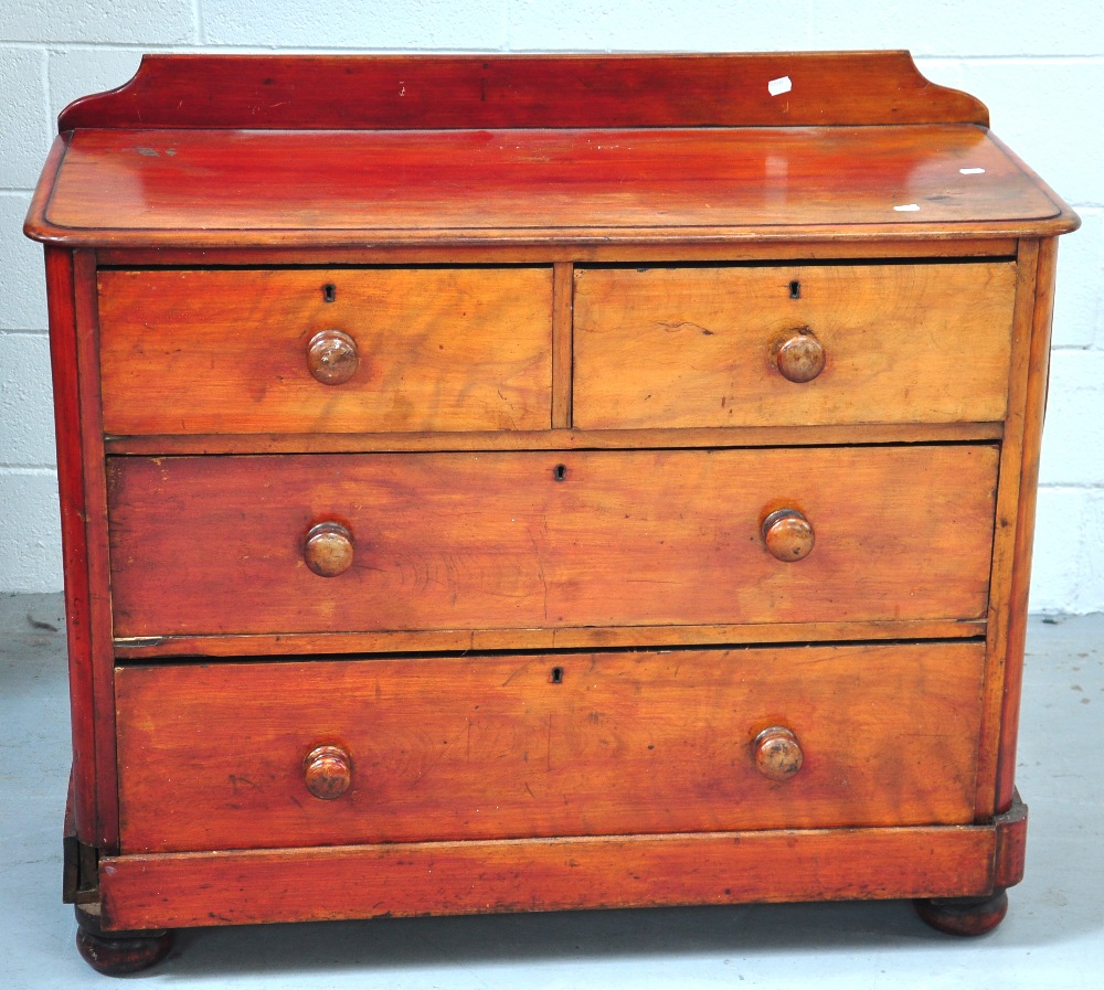 An Edwardian mahogany low two over two chest of drawers.