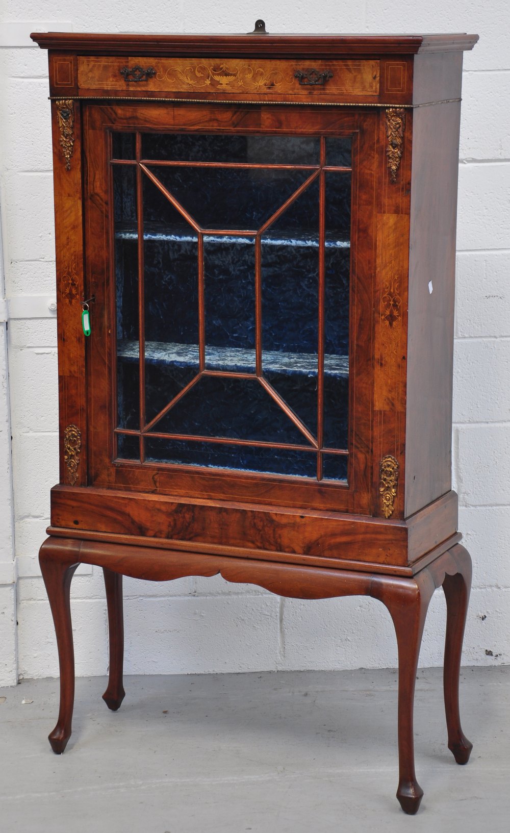 A Victorian walnut and inlaid pier cabinet raised on later cabriole legs, height 148cm.