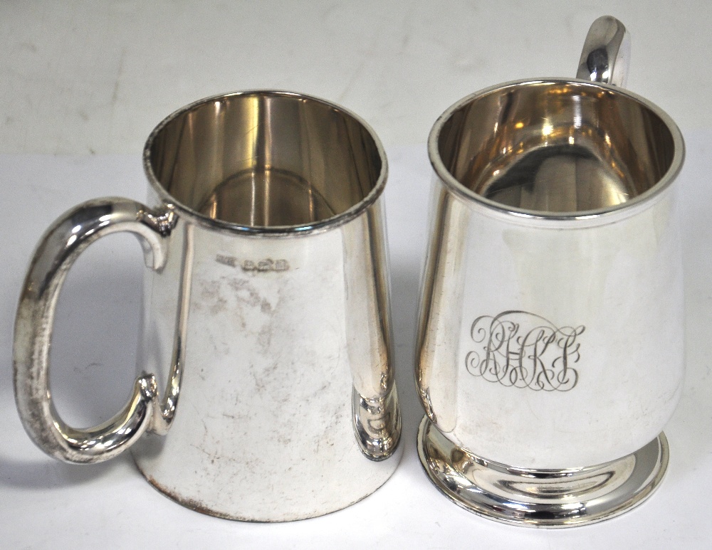 A George v hallmarked silver mug, Birmingham 1911, height 9cm, and a George V hallmarked silver mug,