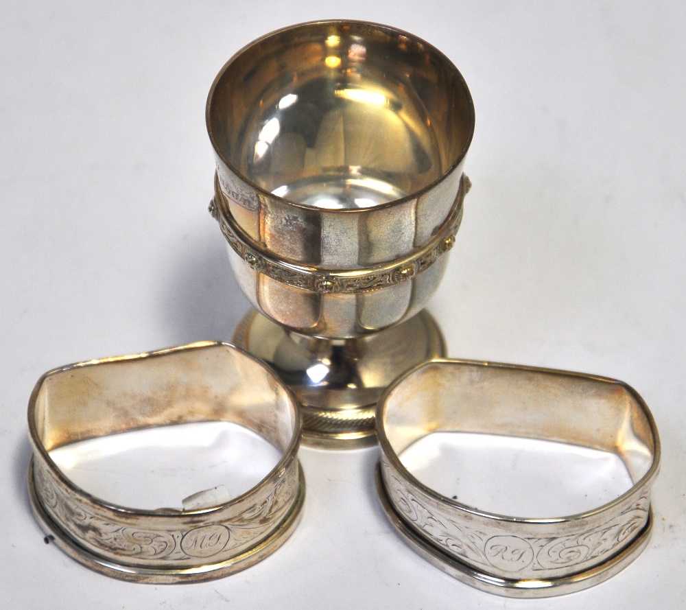 A George VI hallmarked silver egg cup with Celtic design to rim, Birmingham 1950 and a pair of