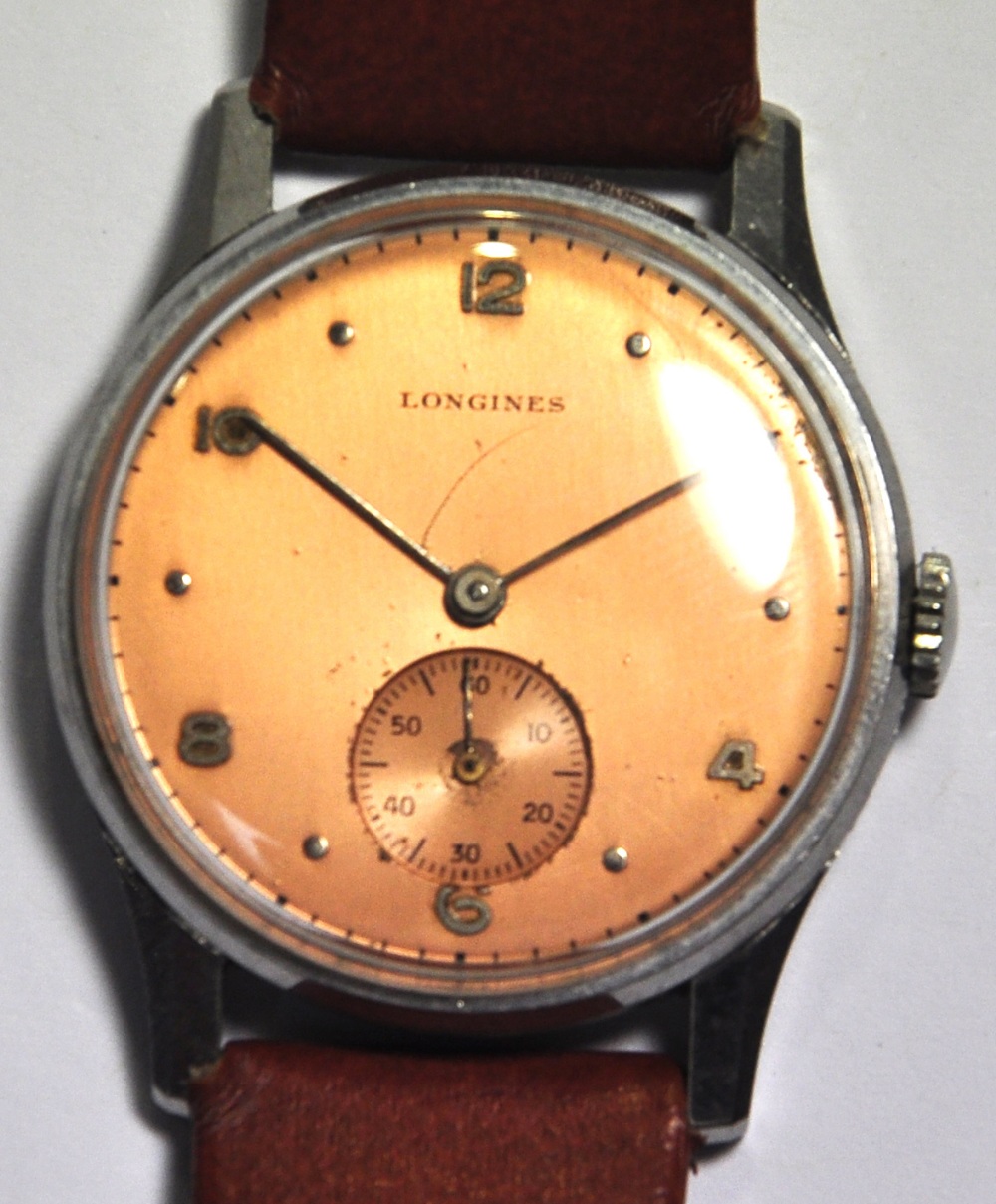 A Longines slim line gents wristwatch.   CONDITION REPORT  At present in working order.