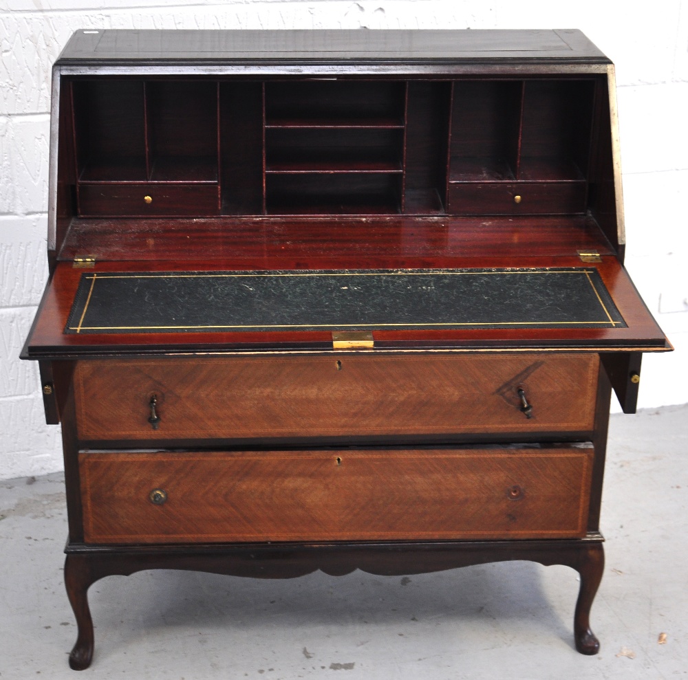 An Edwardian three drawer mahogany bureau a/f. length 90cm.