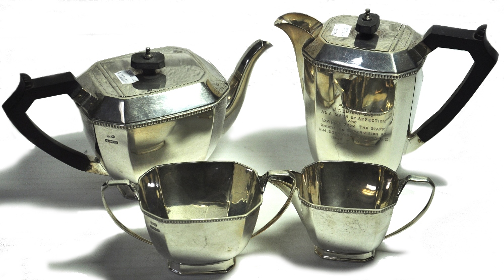 A George VI hallmarked silver four piece tea service, teapot, water pot, milk jug, sugar bowl with