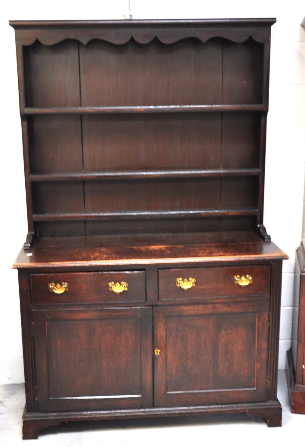 An early 20th century oak dresser with plate rack, height 190cm.