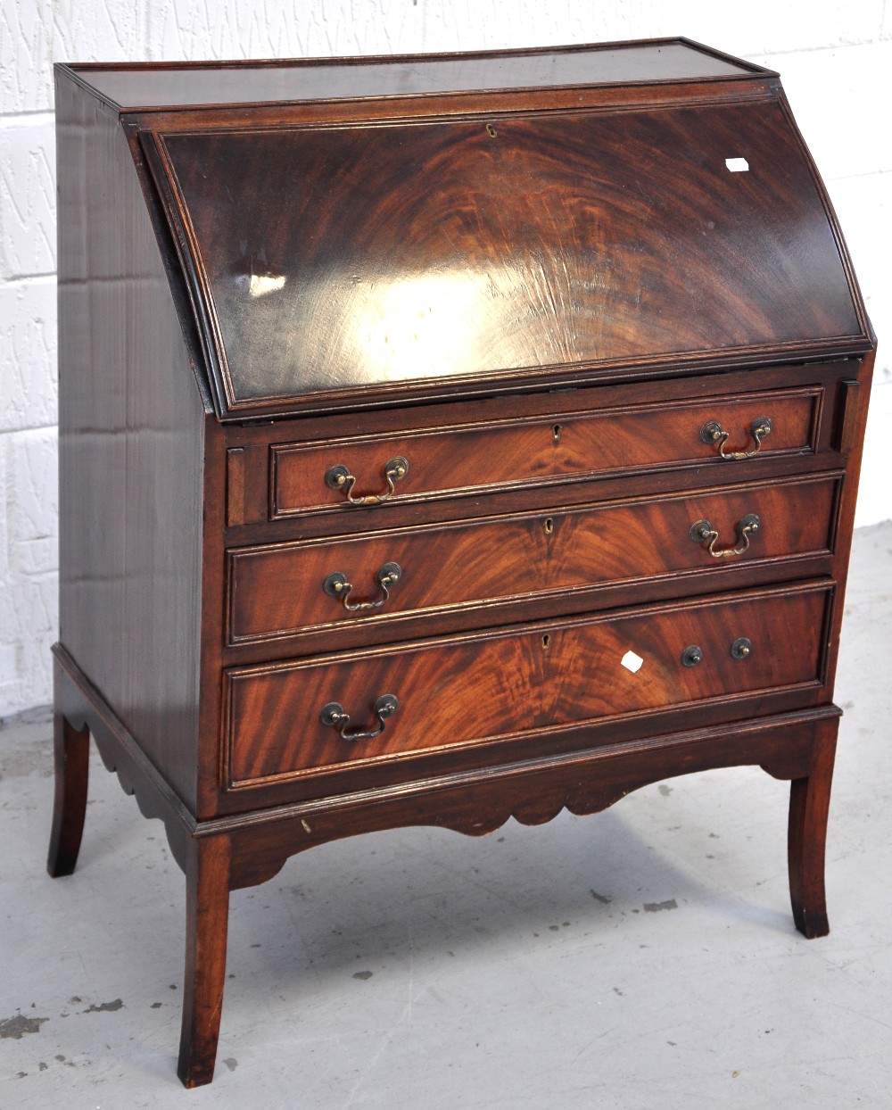 A small reproduction mahogany bureau.