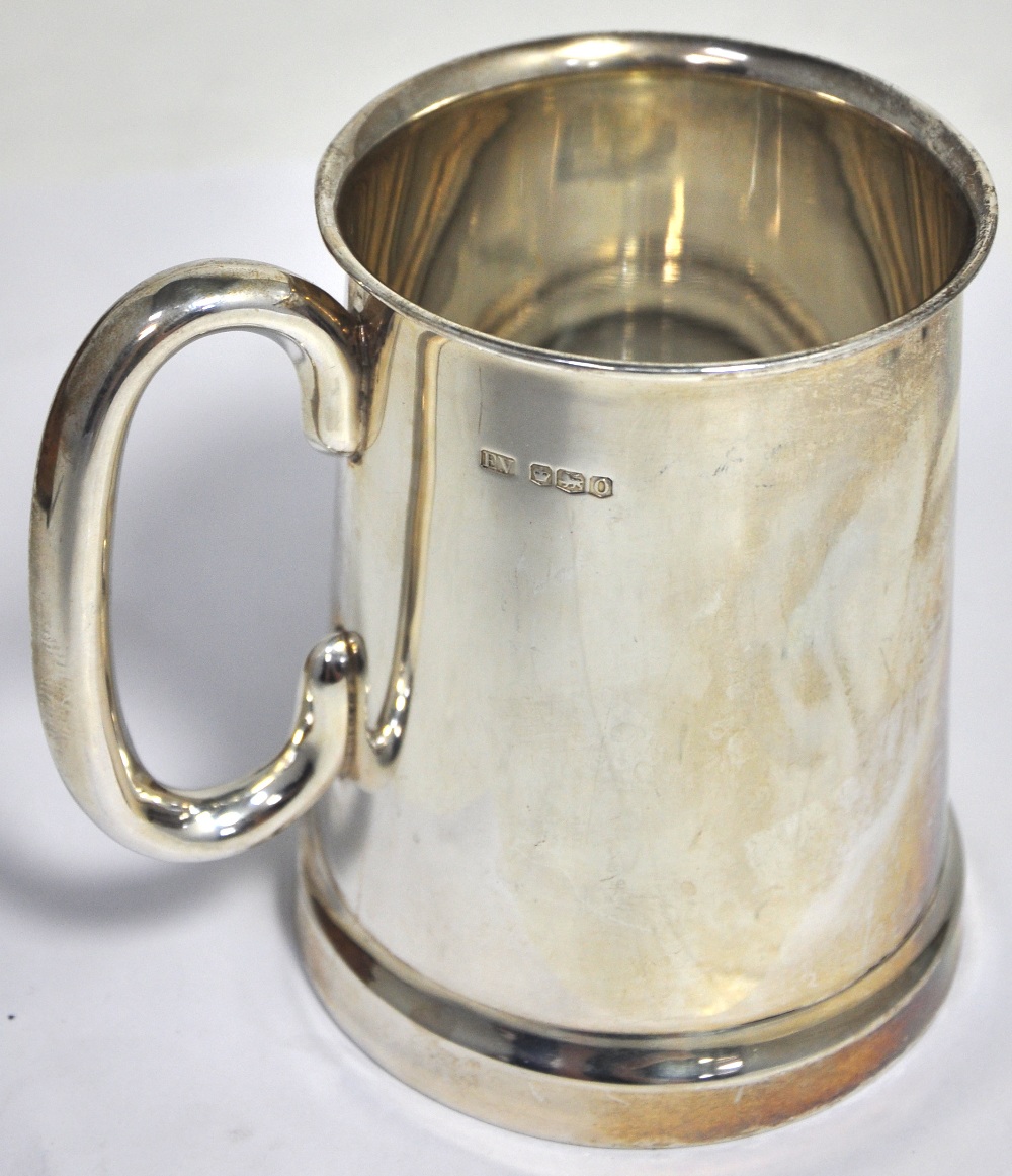 A George V hallmarked silver mug with glass bottom, Sheffield 1931, height 13cm, approx 14ozt.
