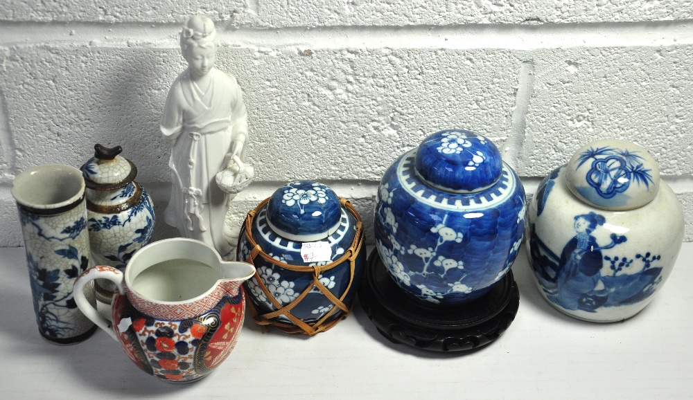 A Chinese blue and white ginger jar decorated with cherry blossom, a Chinese crackle glaze