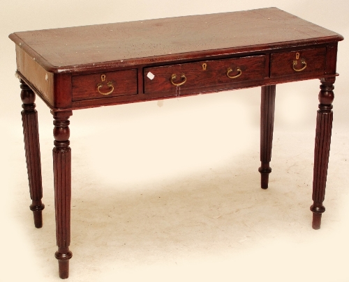 An Indian side table, the rounded rectangular top above three frieze drawers raised on fluted