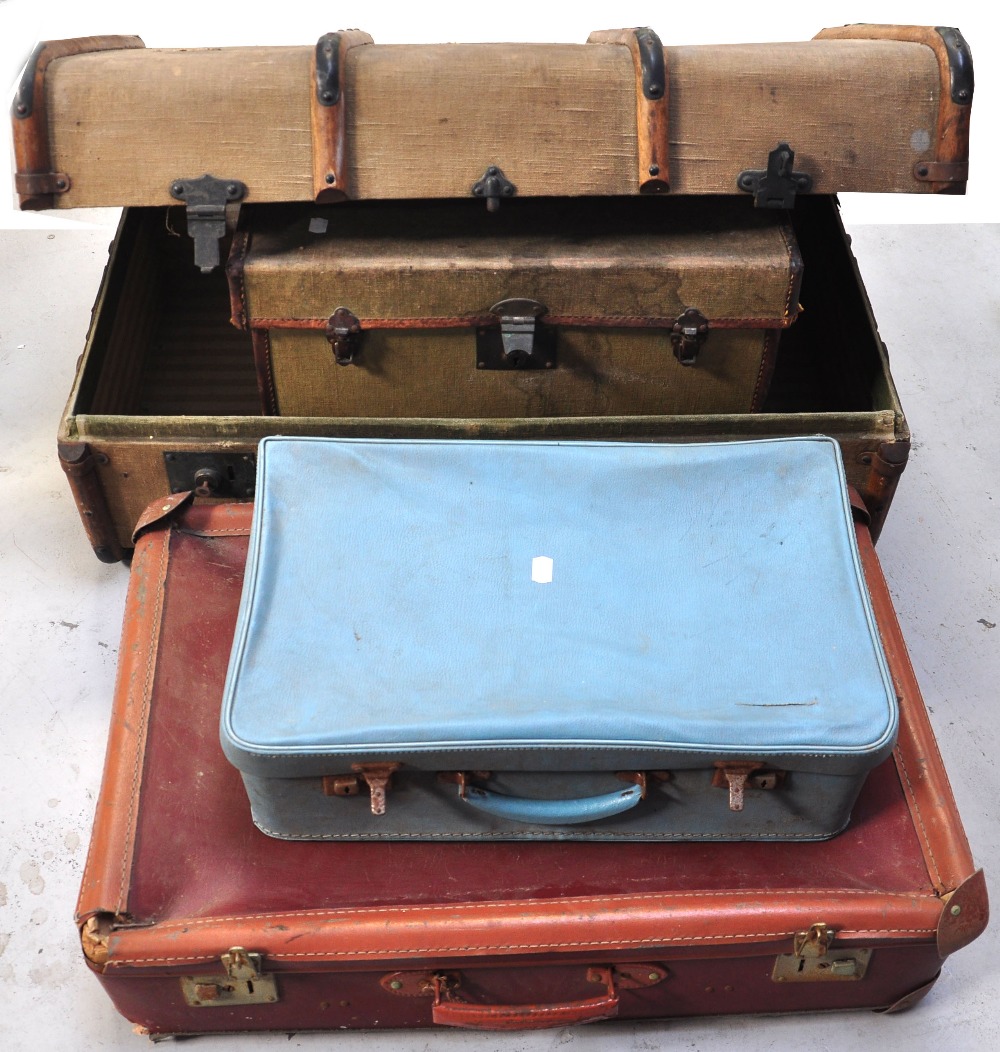 A linen covered travelling trunk with wooden stays, a linen travelling chest with original Paris