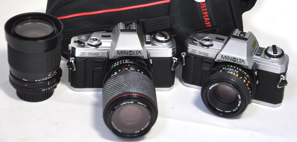 Two Minolta X-300 35mm SLR cameras, one with 50mm 1.7 standard lens and a Sigma 35-70mm zoom lens