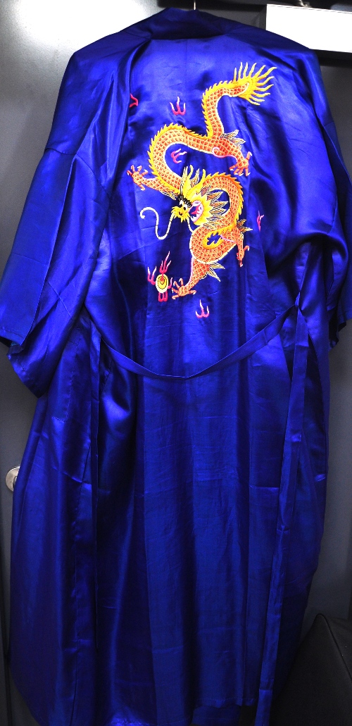 Two Chinese "Golden Dragon" brand embroidered silk kimonos and a concertina book containing prints