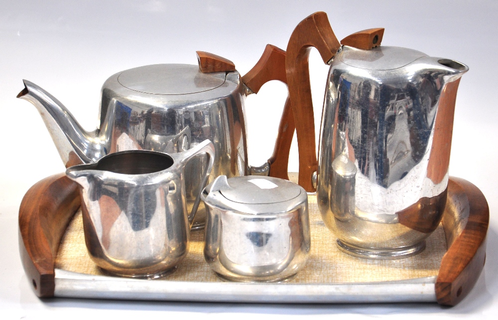 A Piquot ware tea service comprising a teapot, milk jug and coffee pot on matching tray.