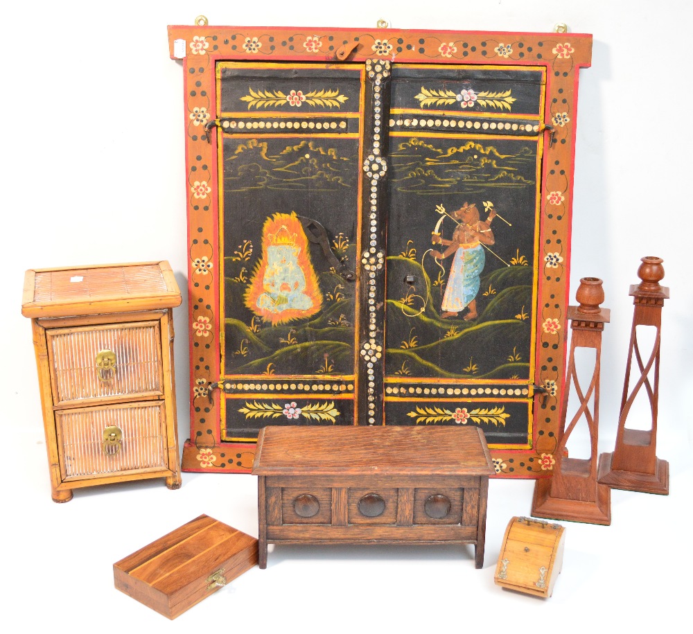 A 20th century Indian painted wooden panel and a quantity of treen including a pair of candlesticks,