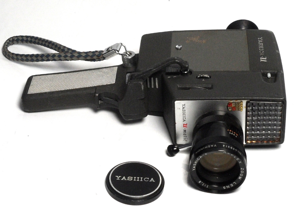 A Yashica-U 8mm cine cinema in original carrying case and a Kodak brownie 8 movie projector in