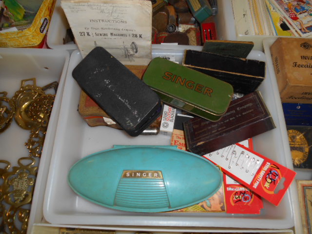 A Box of Vintage Singer Ephemera to include a button holer, old instruction manual, pins, etc.