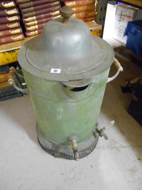 A Metal Boiler with Earthenware Liner, with taps.