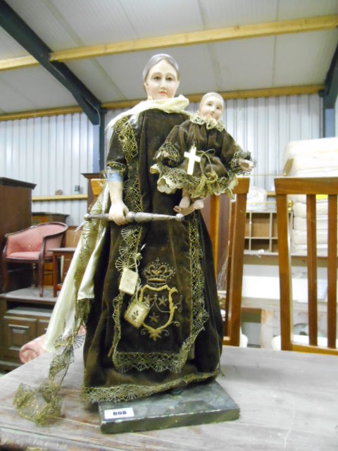 An Early 20th Century Carved Pine Gesso Religious Doll, Woman Carrying a Child, with hand-made