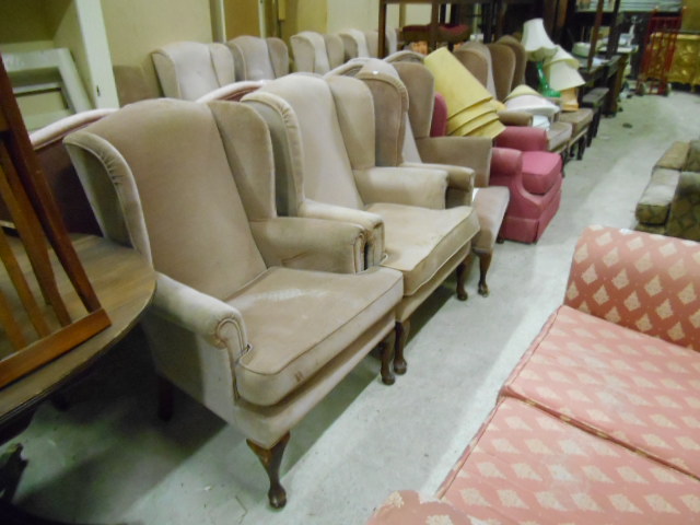 Six Wingback Armchairs.