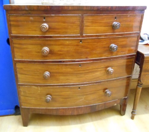 A Georgian Mahogany Bowfront Chest of Drawers, two short over three long.