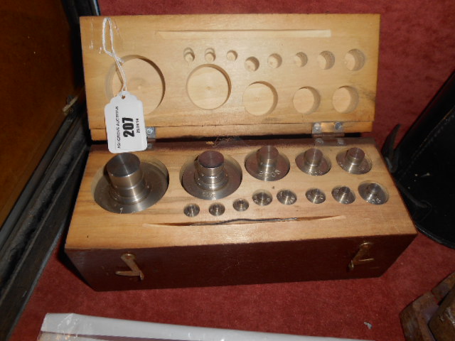 A Set of Thirteen Steel Capstan Weights up to 1kg, cased.