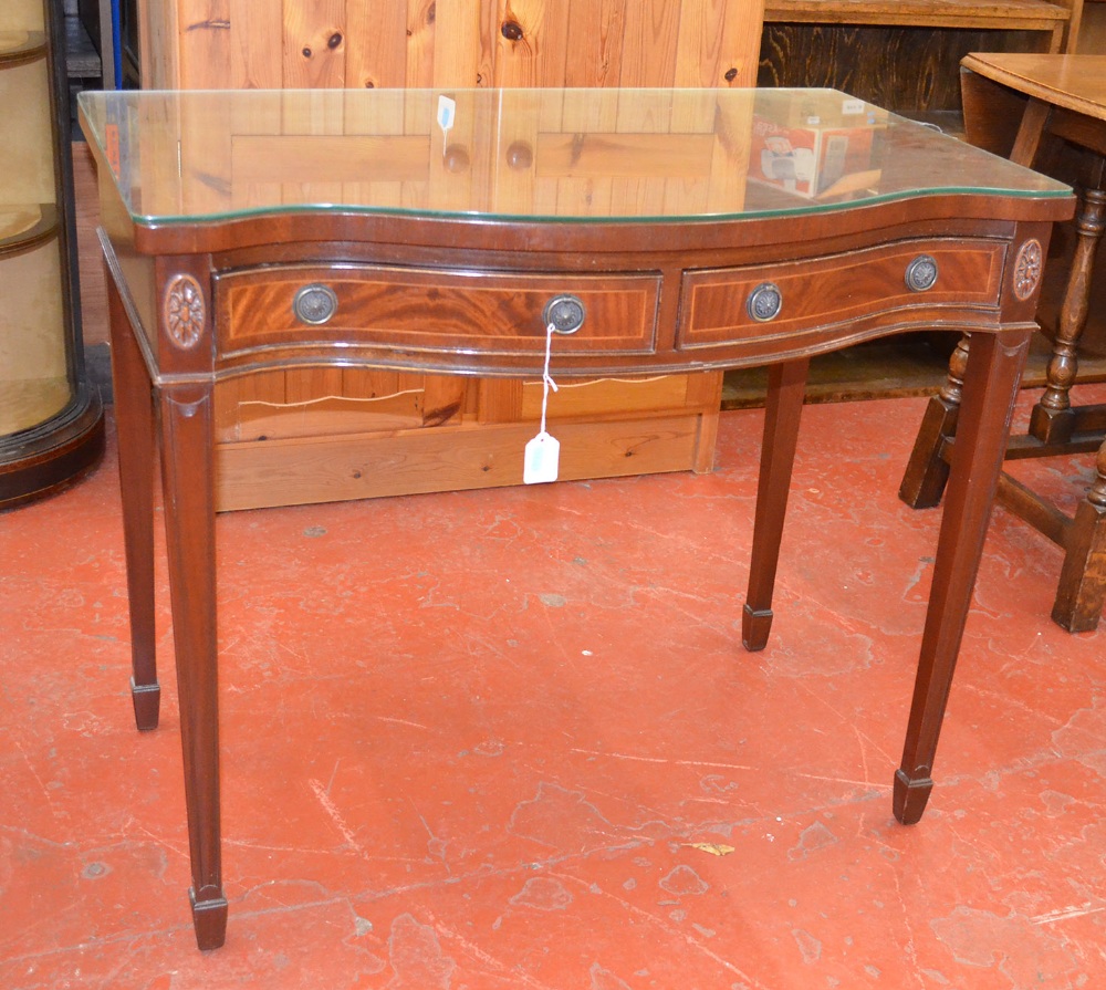 An Art Deco style hall table, serpentine fronted with walnut inlay.