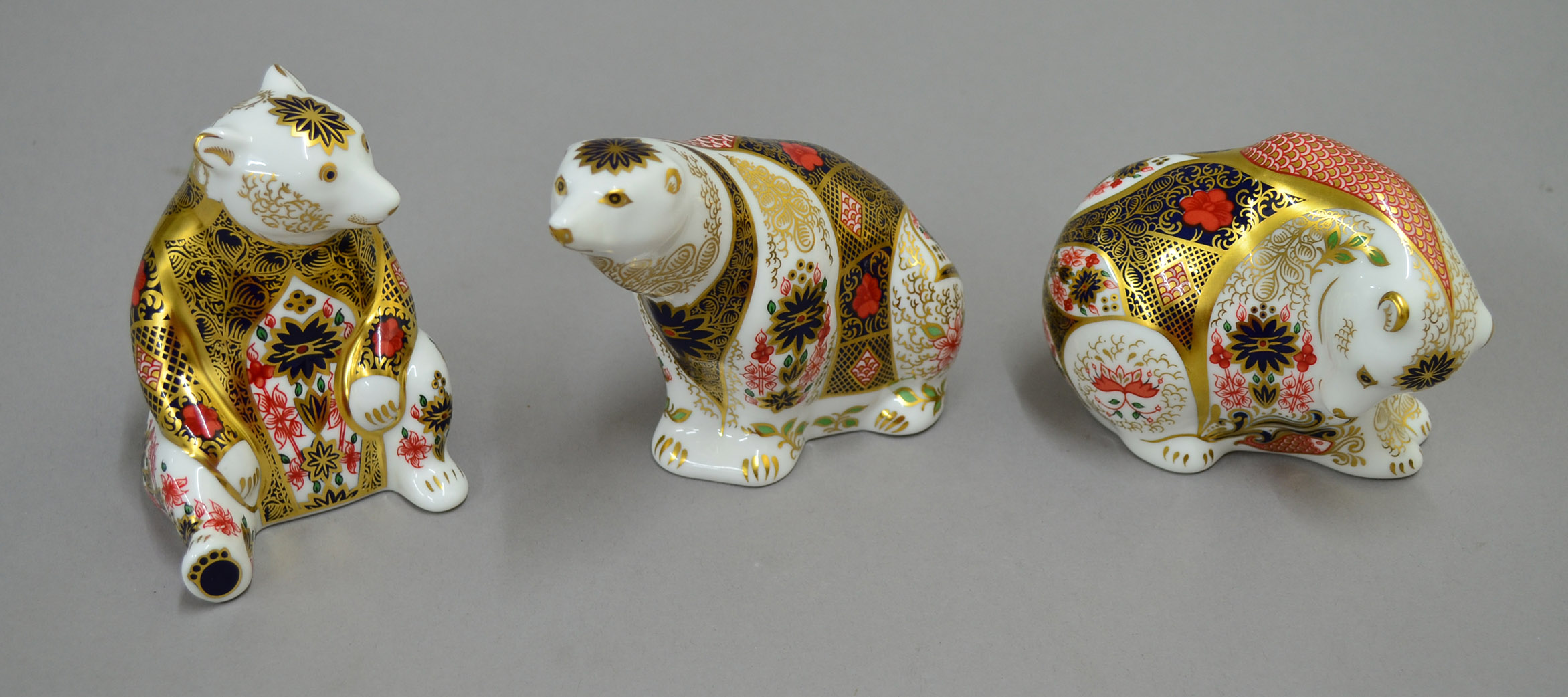 Three Royal Crown Derby bear paperweights. All boxed.