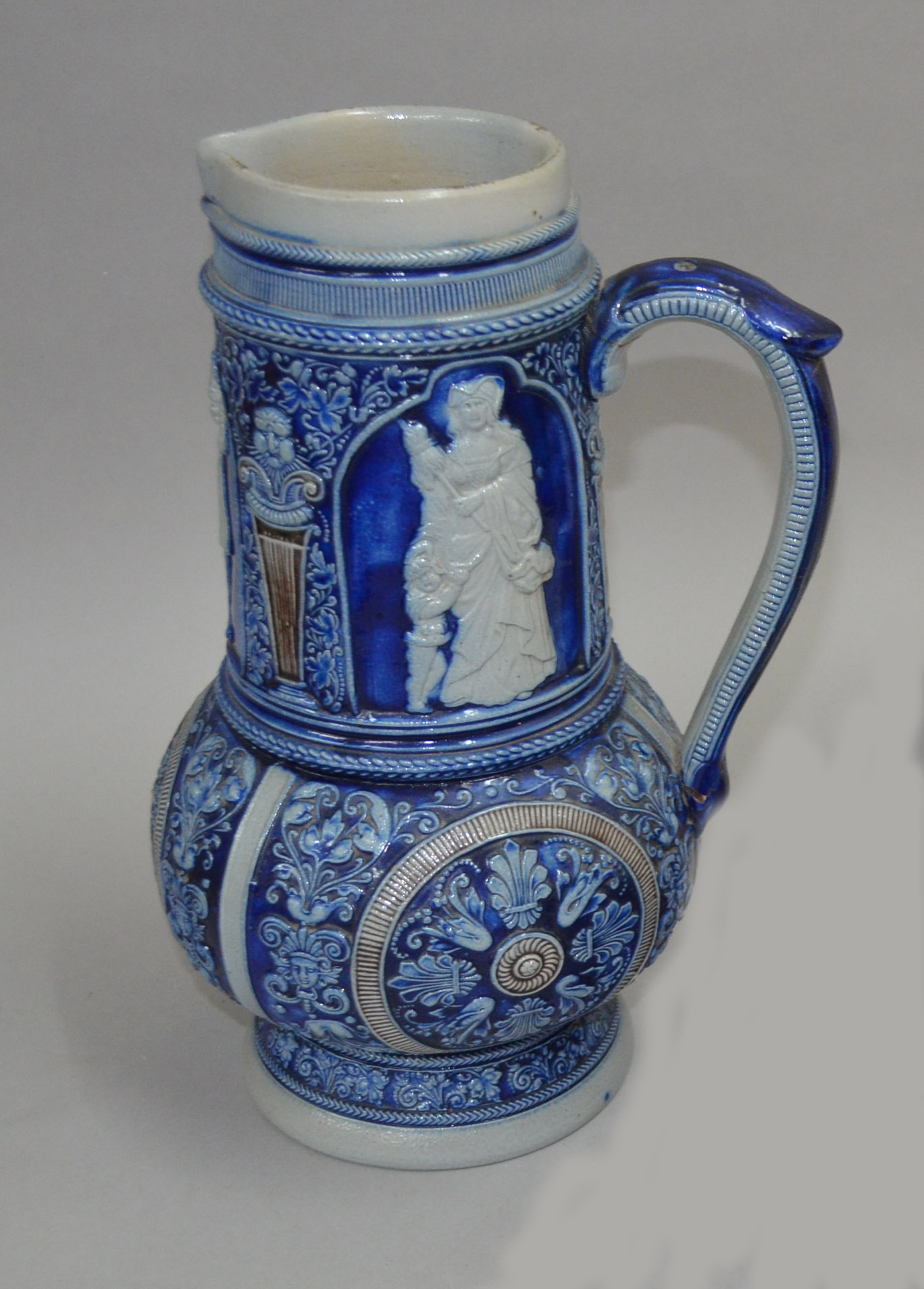 Good quality blue and white stoneware jug, incised `775B` and other marks to the base.