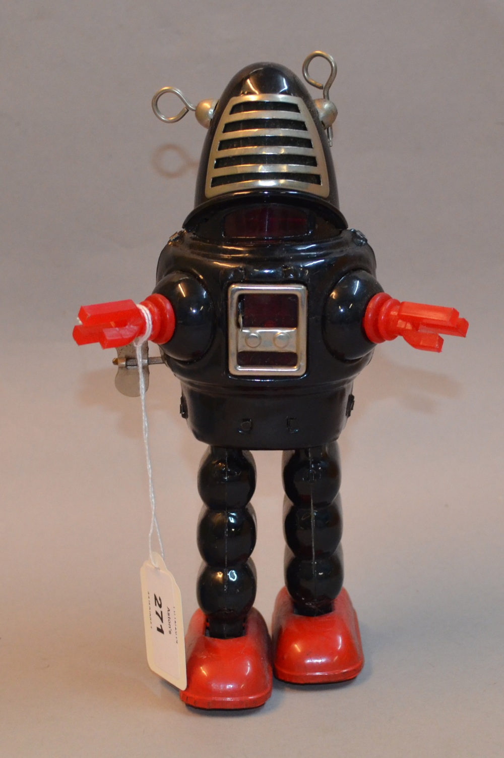 Yoshiya (Japan) Planet Robot, tinplate robot in black with red feet and red plastic hands, wind up