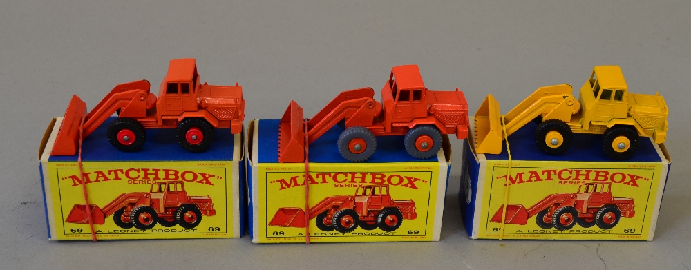 Lesney Matchbox #69 Hatra Tractor Shovel, three variations: first with orange body, orange shovel,