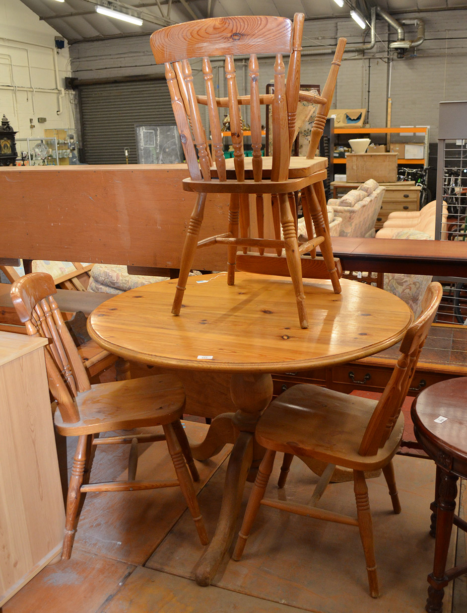 Circular pine table and four chairs.