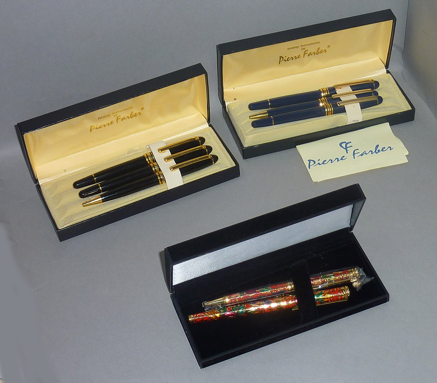 Two Pierre Farber pen sets (three pens in each), together with another West German set (two pens).