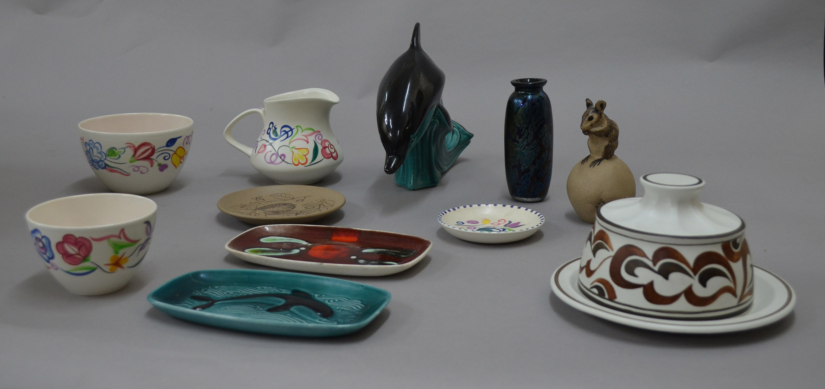 Eleven items of Poole Pottery.