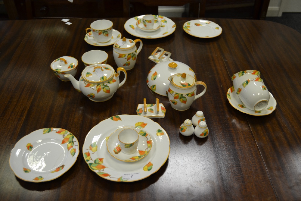 A Foley part breakfast service, painted with autumnal leaves, comprising teapot, covered milk