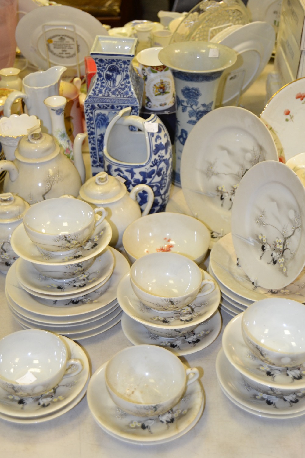 A Japanese eggshell porcelain export ware tea service including teapot, cups, saucers, side plates
