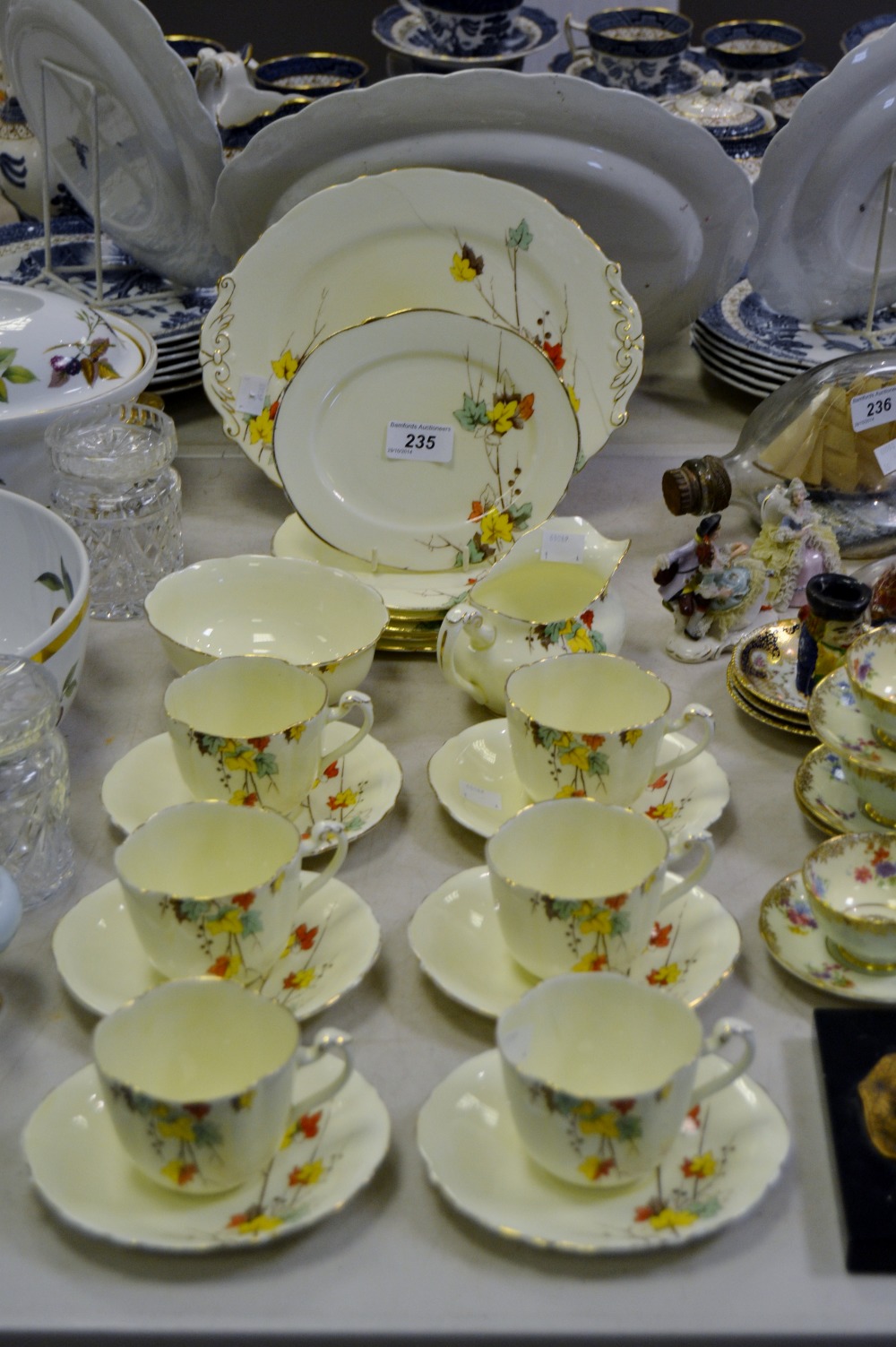 A 1930s Paragon tea set, printed with autumnal leaves, comprising bread plate, milk and sugar, cups,