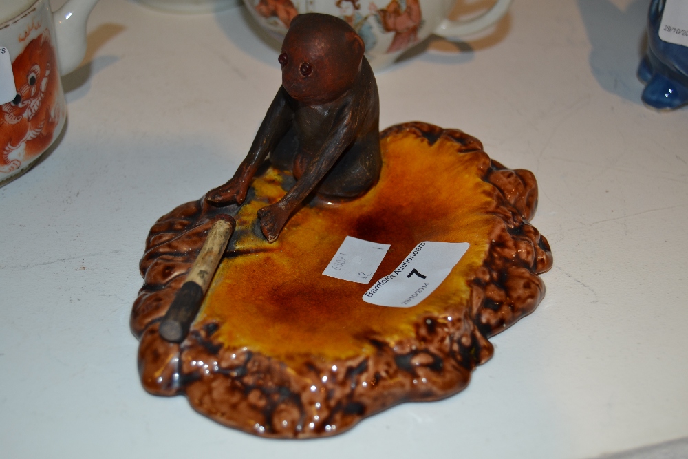 A Bretby novelty ashtray as a smoking monkey, designed by Rodolfo Eisler, impressed and incised