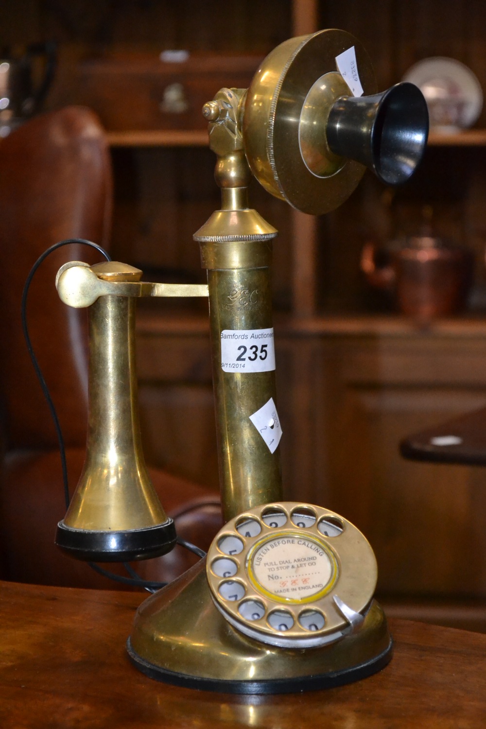 A reproduction brass candlestick telephone , marked GEC, 33.5CM  high